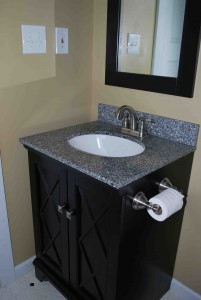 This bathroom vanity...bought on clearance...adds to the country-cottage look of this small master bath.