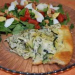 Served here with a garden-fresh salad, this zucchini pie is a light, fresh option for brunch, lunch, or dinner.